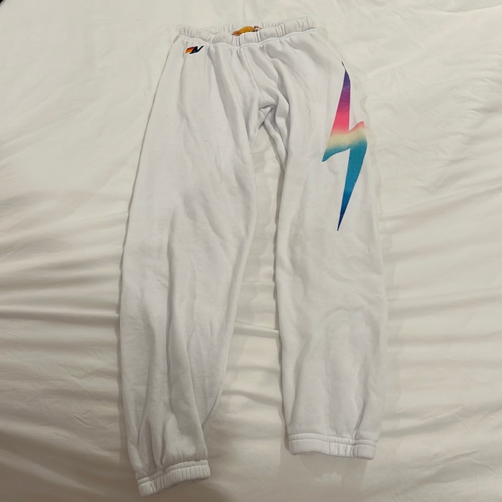 White Aviator Nation sweatpants.